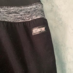 Grey’s Anatomy 1 pair of scrub pants and 2 tops.  Black